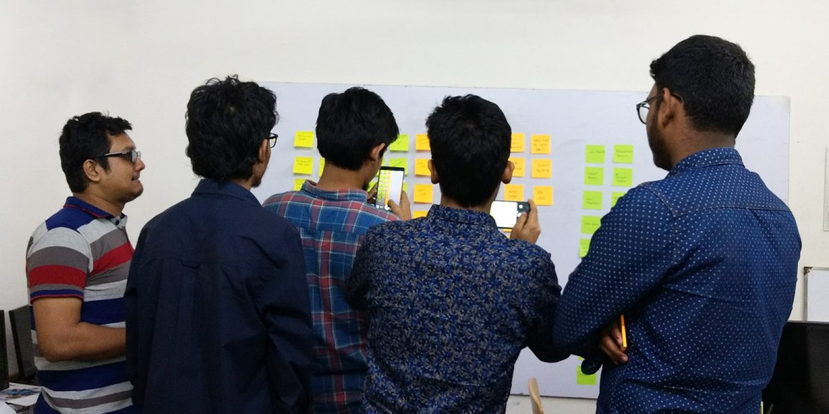 UX Design students in doing card sorting in a brain storming session